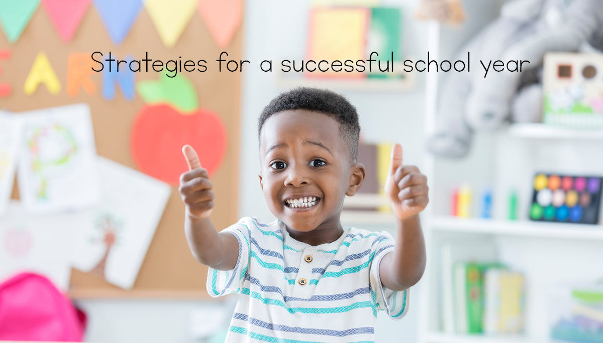 smiling boy at school with two thumbs up and the words "strategies for a successful school year" above it