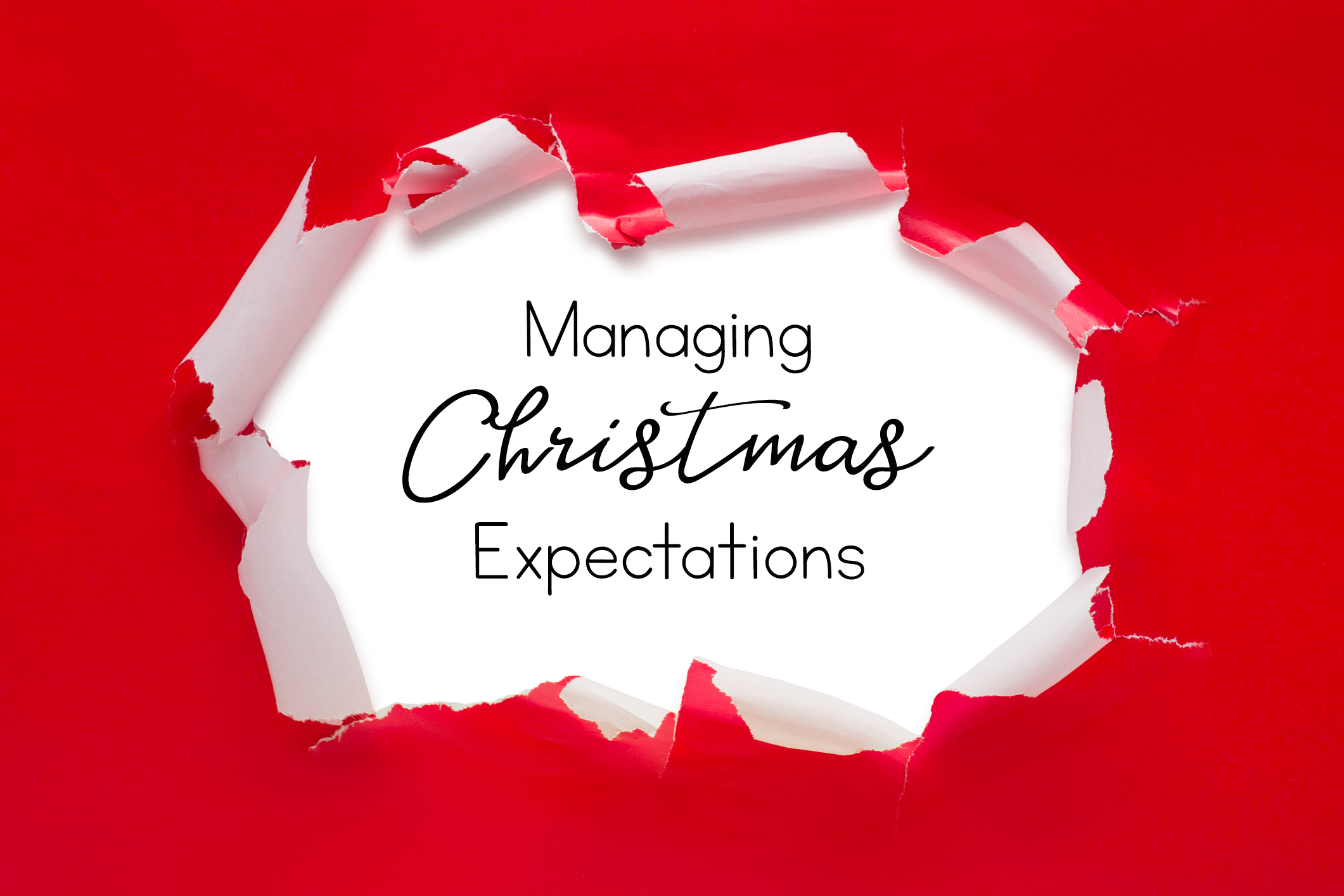 words Managing Christmas Expectations behind red wrapping paper